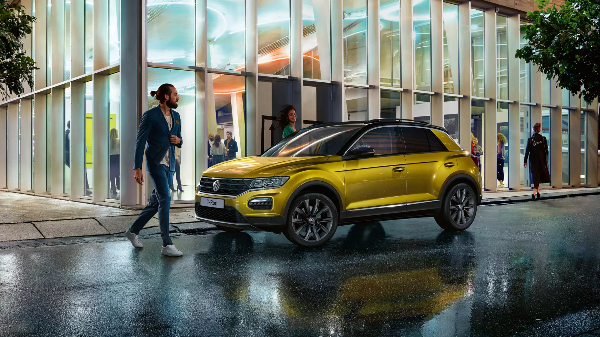 Auto rain sensors An individual crossing the road while a yellow Volkswagen vehicle is parked beside a building at an outdoor urban setting under a rainy weather.