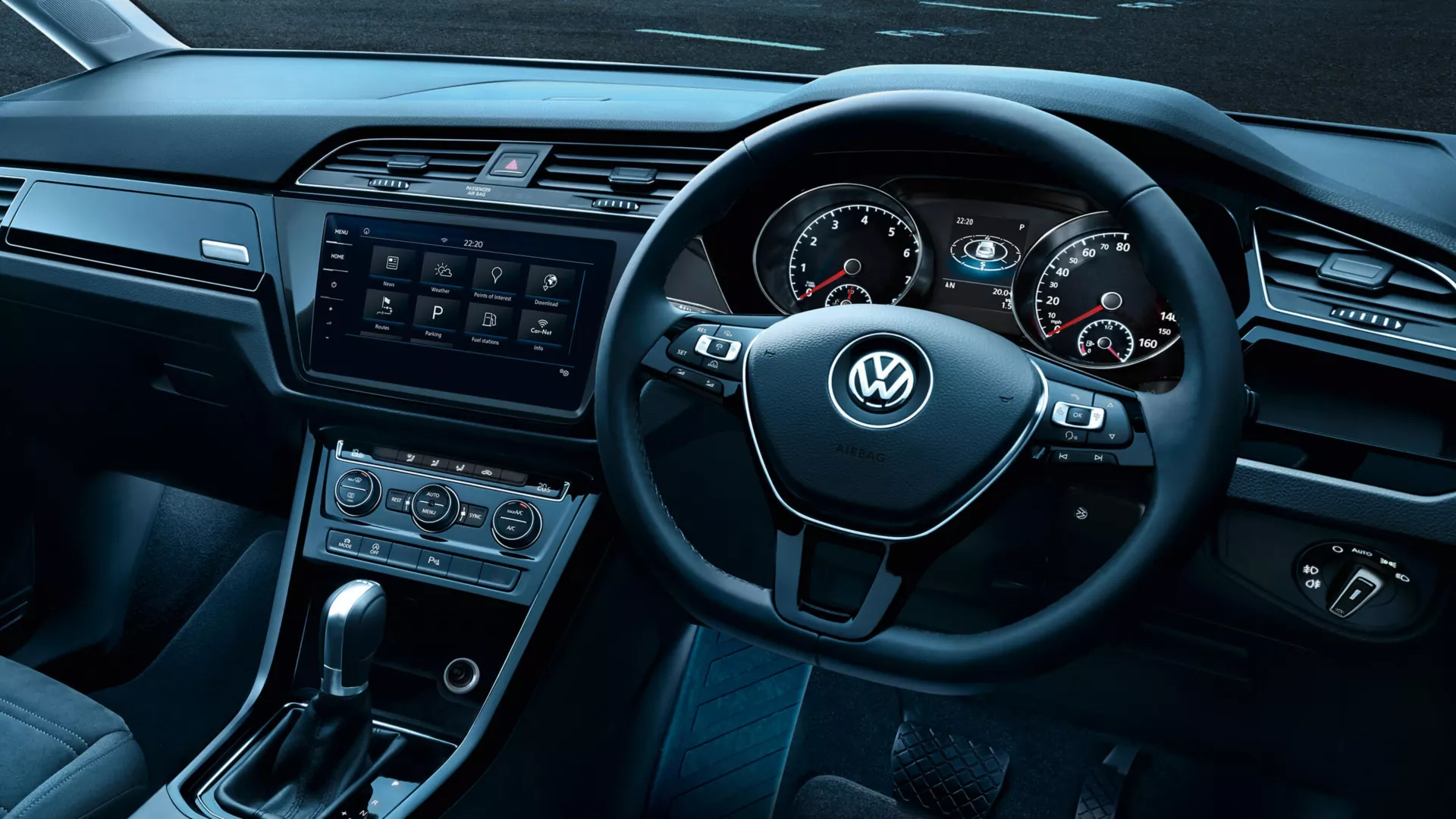 Cockpit | Multifunction steering wheel A close-up look of a Volkswagen vehicle's interior cockpit area highlighting its multifunction steering wheel.