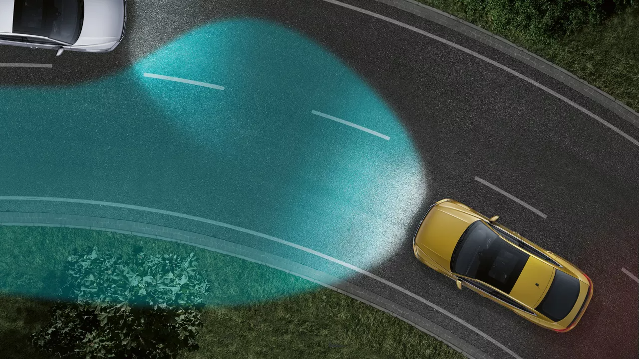 Lighting systems | Predictive dynamic cornering lights An image depicting dynamic cornering lights being triggered on an incoming corner on the road.