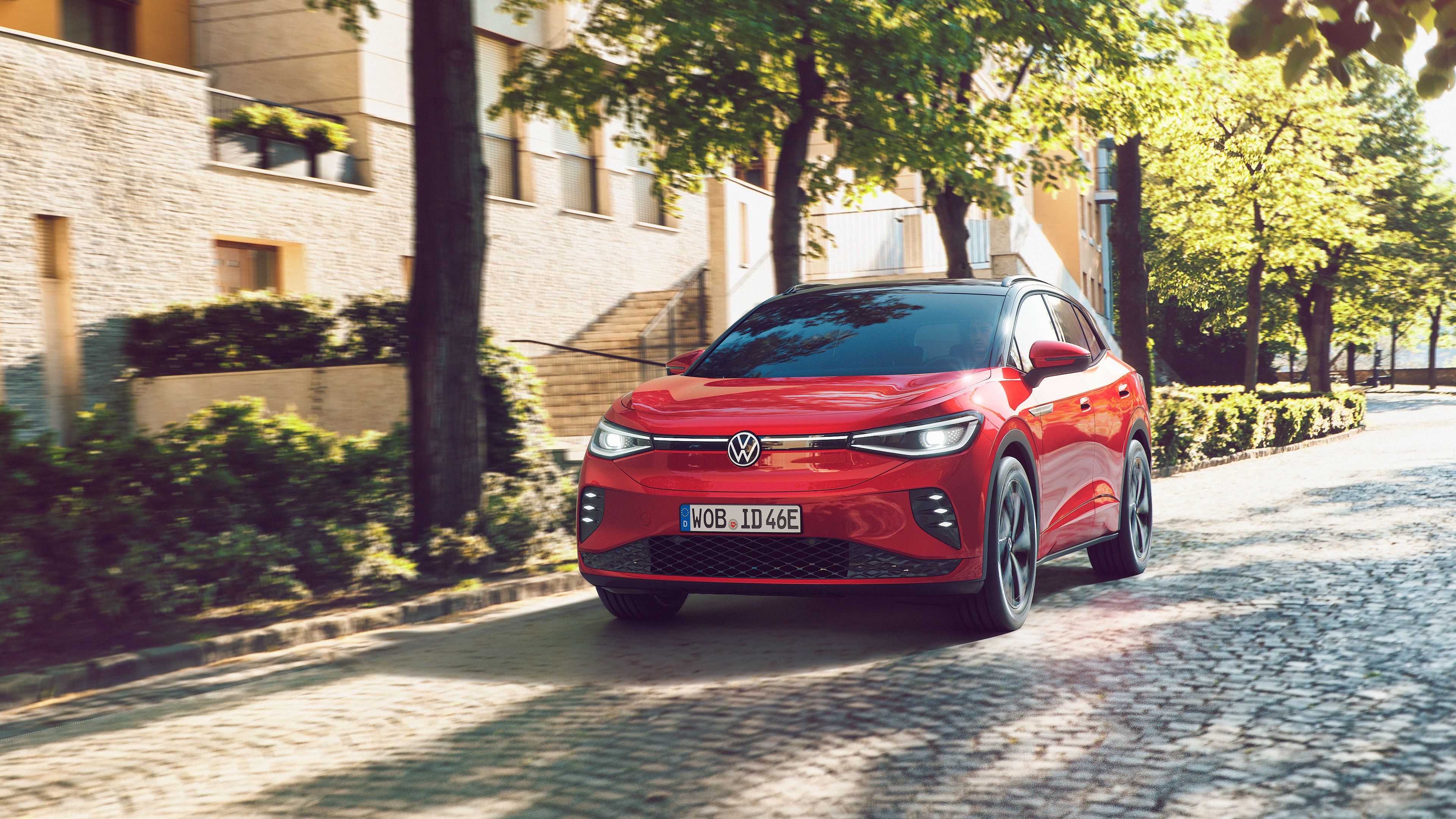 The ID.4 GTX The Kings Red Volkswagen ID.4 GTX cruising down a cobblestone road