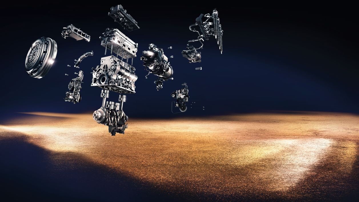 How does it work? A suspended and disassembled image of Volkswagen engine components.