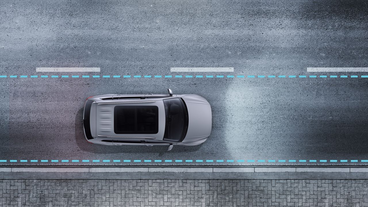 Driver Assistance | Lane Assist An image depicting Lane Assist being triggered to ensure the vehicle does not drift out of its lane.
