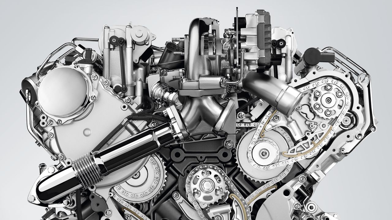 Why drive a TDI? An etched out cross-section image of a Volkswagen TDI engine.