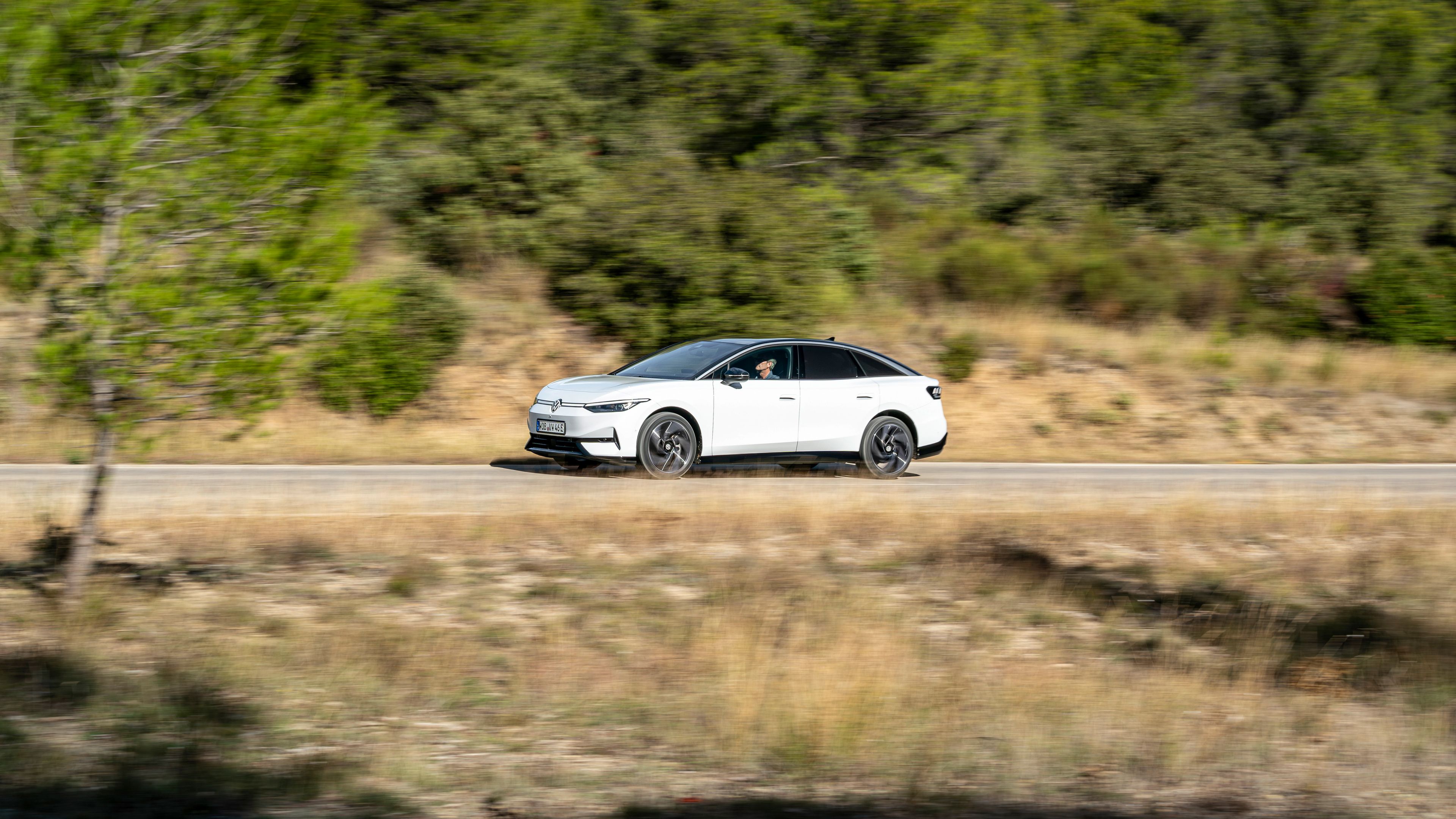 Register your interest ID family A white ID.7 passing by on the road