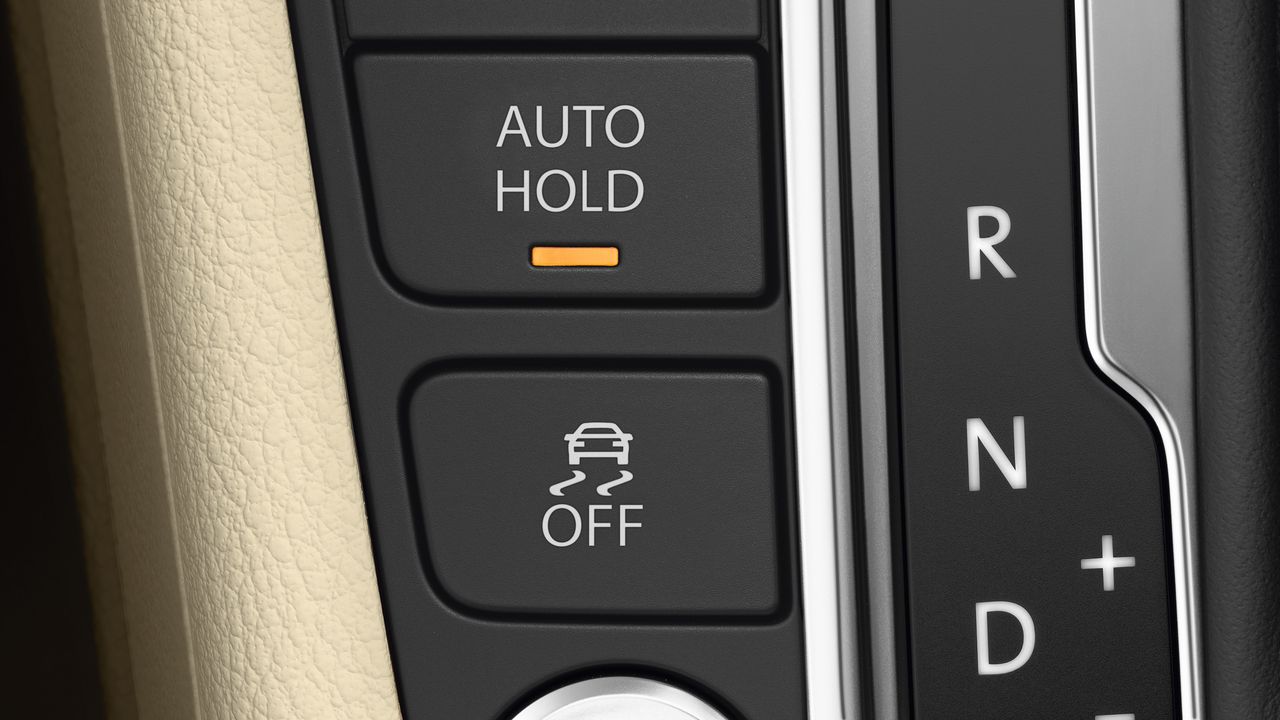 Auto Hold | Electronic parking brake system A close up look of a Volkswagen vehicle's Auto Hold system being switched on.