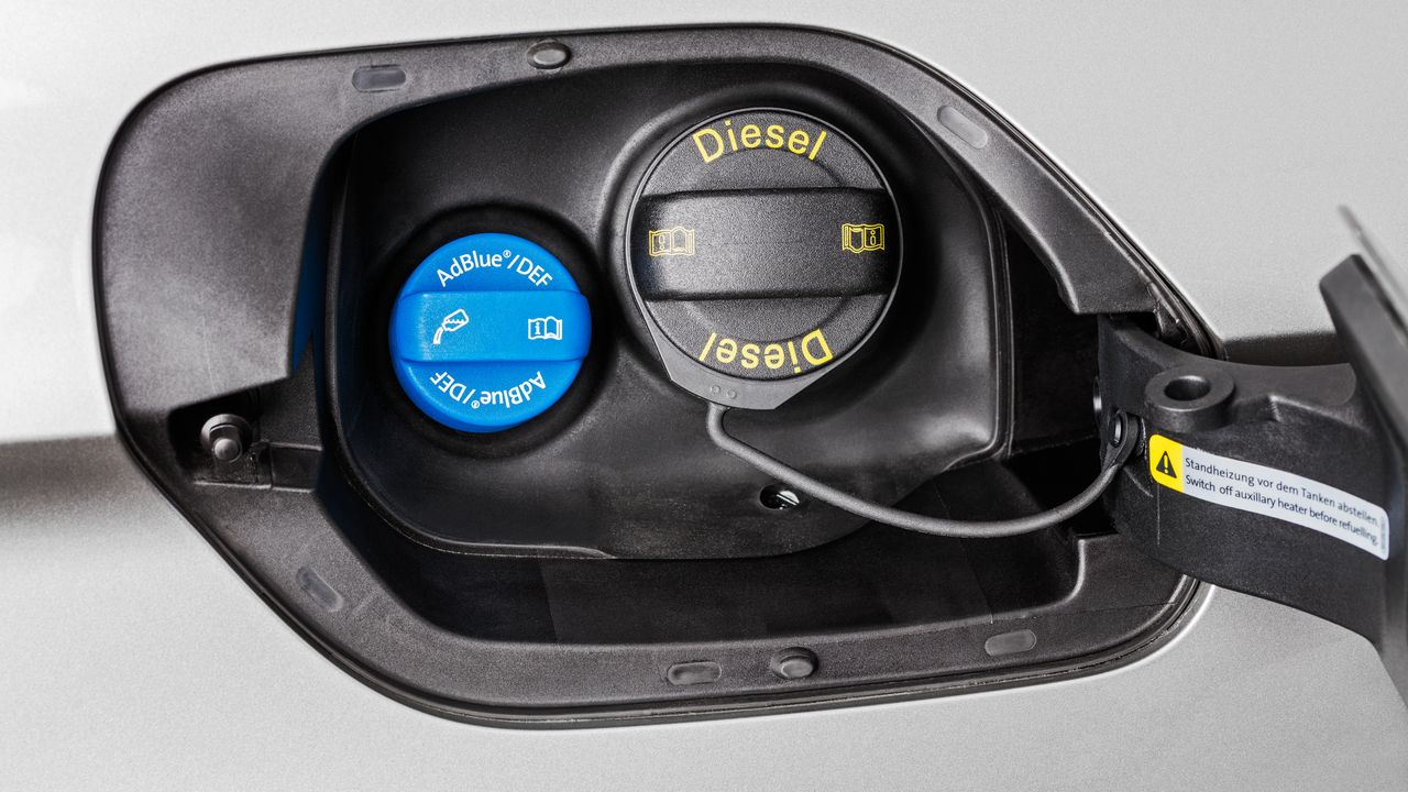 AdBlue: Selective Catalytics Reduction (SCR) A close up view of a Volkswagen vehicle's fuel and AdBlue hatch when opened.